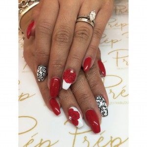 Red fancy nails with black and white details